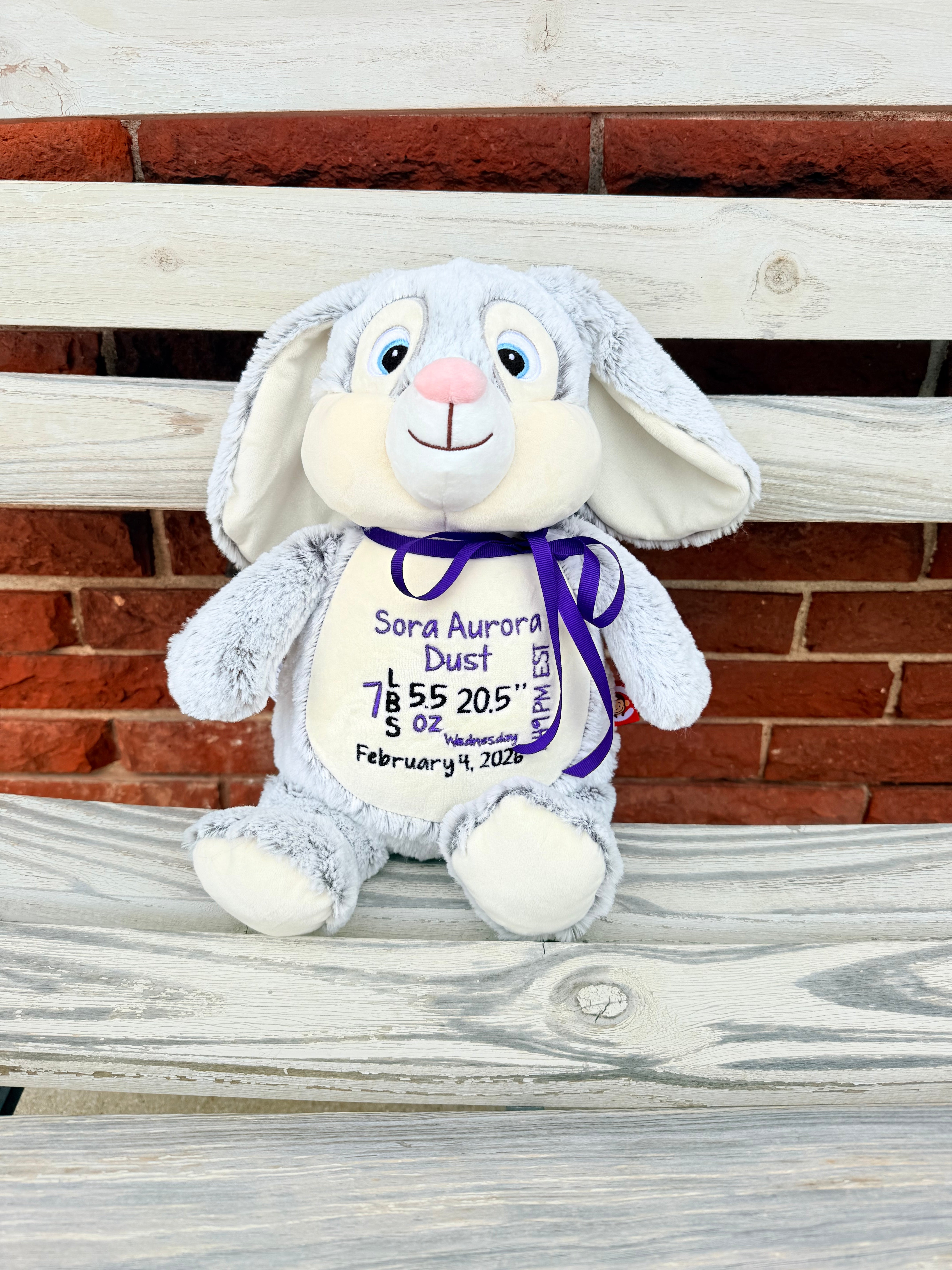 Gray and white stuffed animal bunny embroidred with babys birth info.