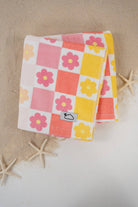 Floral checkered towel on a beige background