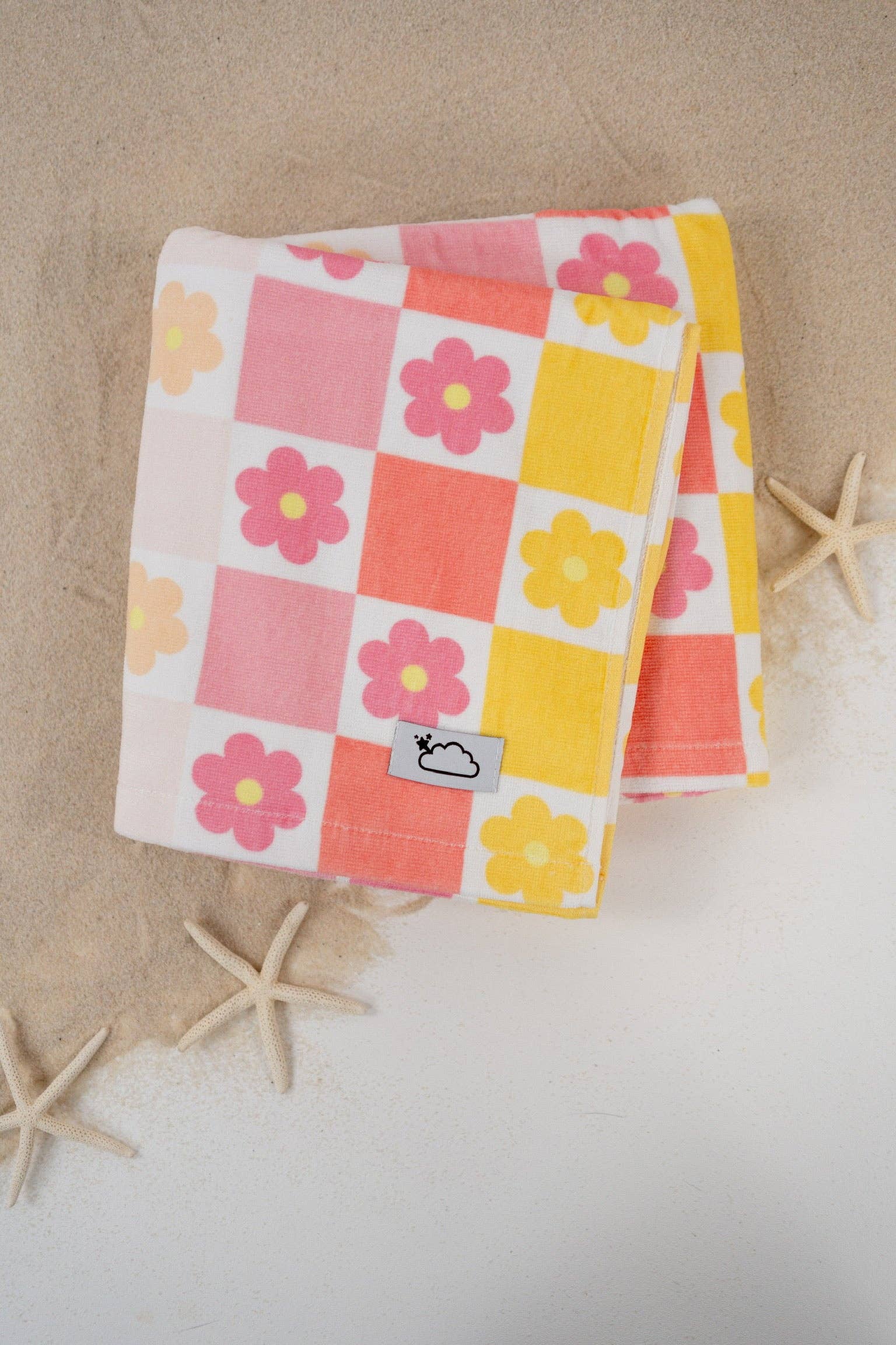 Floral checkered towel on a beige background