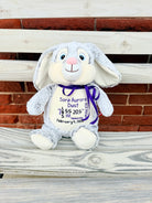 Gray and white stuffed animal bunny embroidred with babys birth info.