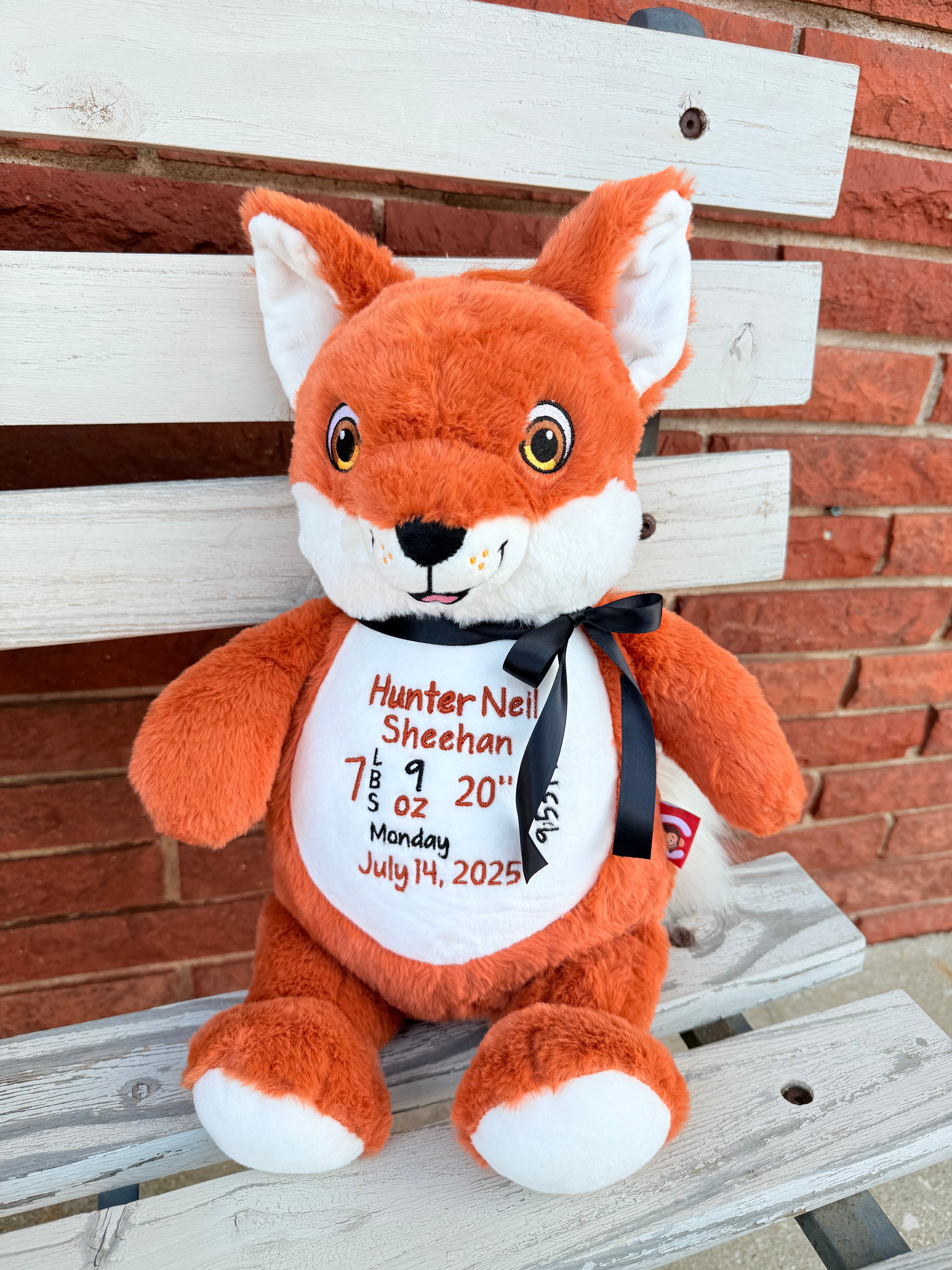 Plush fox toy personalized on a wooden surface