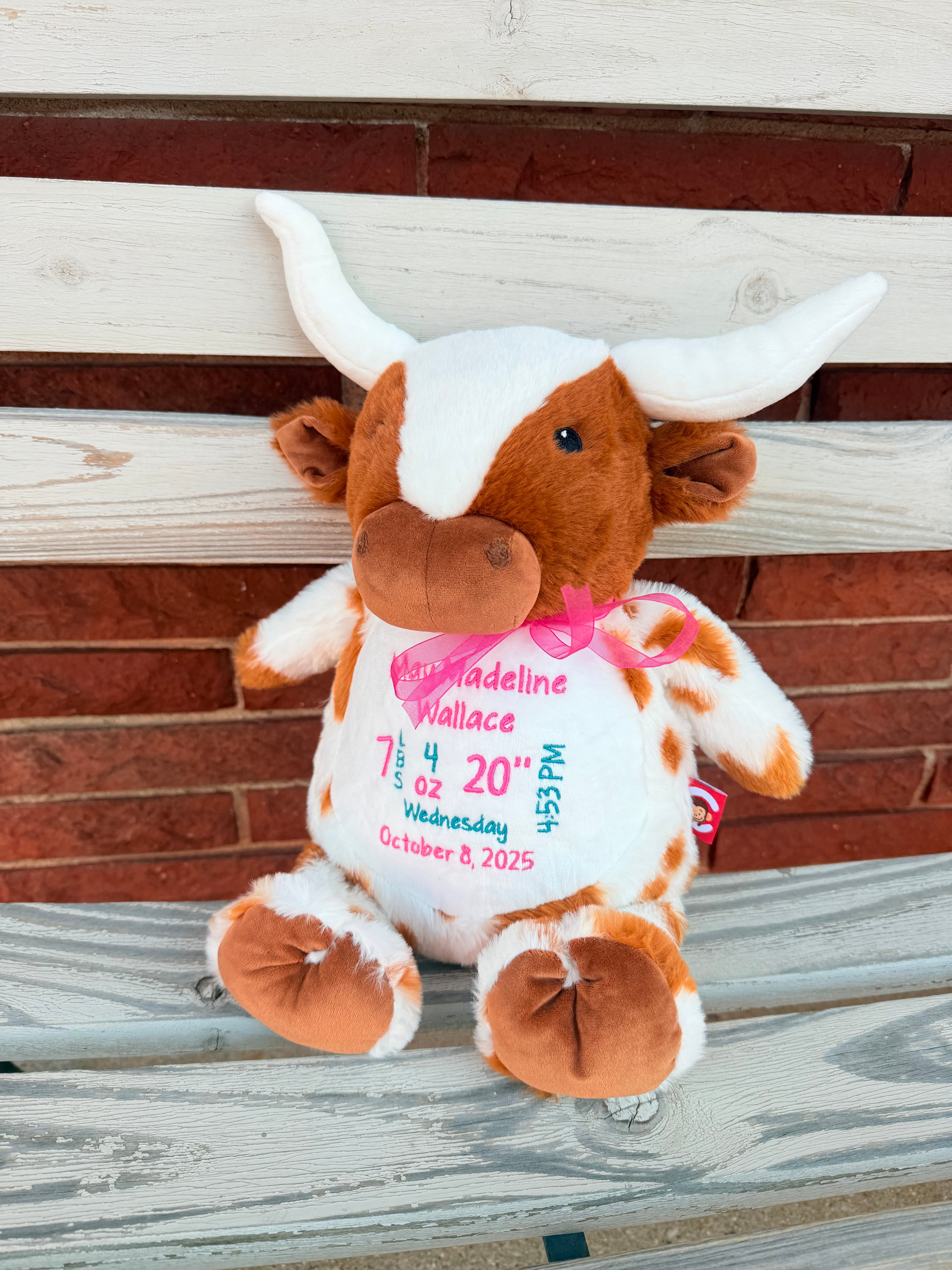 Plush toy with personalized details on a wooden surface